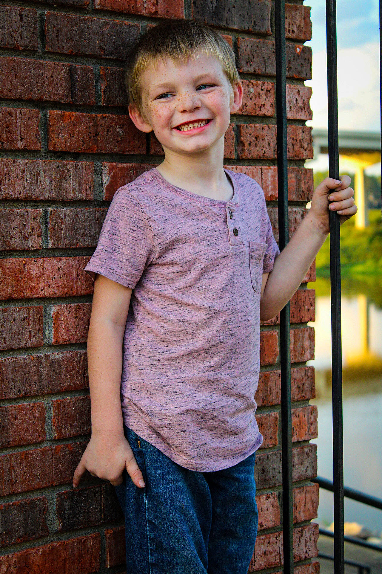 Michael joined the competition — help win amazing prizes! active_shirt, brick, brickwork, child_model, denim, happy, jeans, joy, laugh, mouth, person, sleeve, standing, thumb, tooth