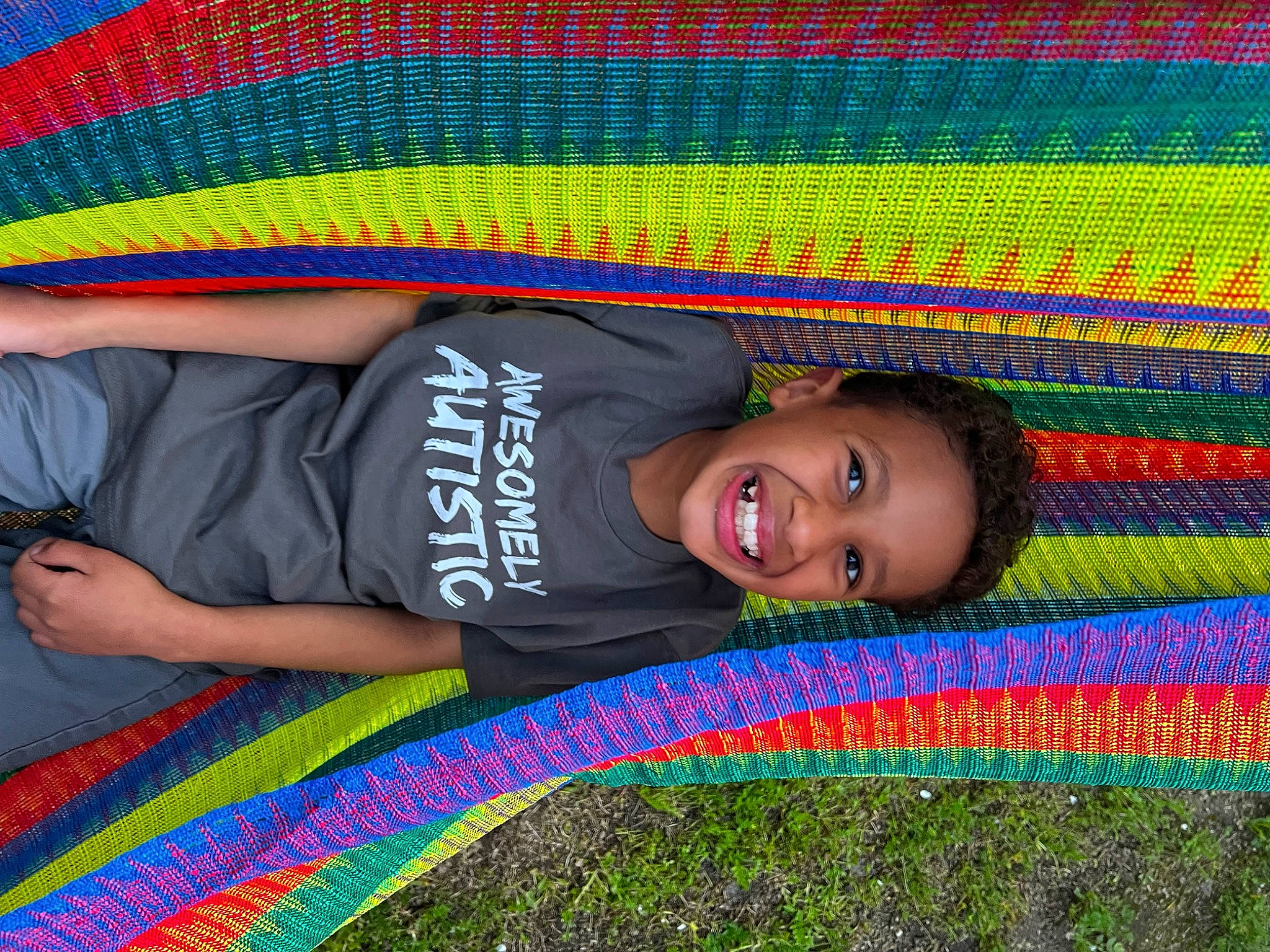 Julian joined the competition — help win amazing prizes! blue, child, electric_blue, facial_expression, flooring, fun, grass, green, happy, joy, leisure, magenta, pattern, people_in_nature, person, play, red, smile, t_shirt, textile