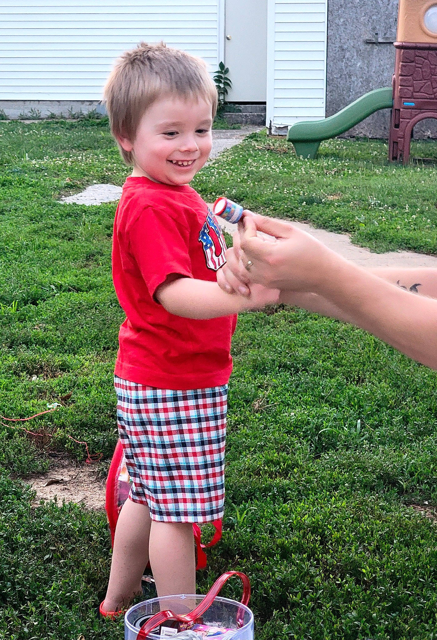 Langston joined the competition — help win amazing prizes! child, event, fun, garden, gesture, grass, green, happy, joy, lawn, leisure, pattern, people_in_nature, person, play, recreation, shorts, smile, t_shirt, tartan