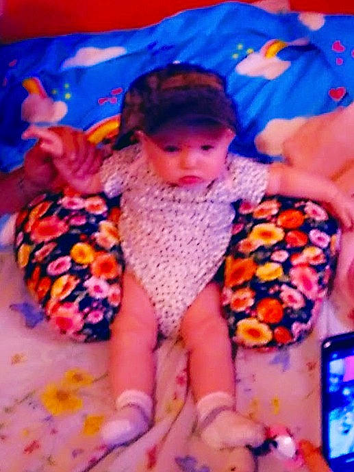 Leeann is registered to the contest to win money with this photo: baby, baby_toddler_clothing, beauty, blue, child, comfort, electric_blue, facial_expression, finger, fun, happy, headwear, leisure, magenta, orange, pattern, person, pink, purple, textile