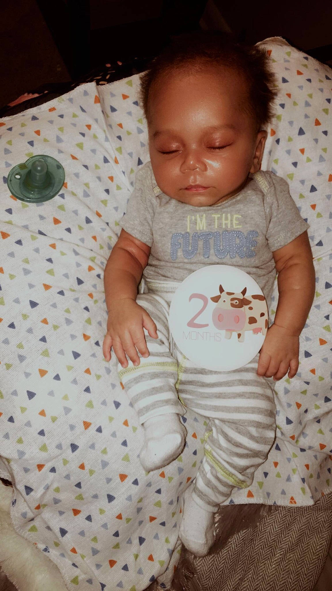 Zakhari is registered to the contest to win money with this photo: baby, baby_products, baby_toddler_clothing, cheek, child, foot, human, kitchen_utensil, linens, mammal, nightwear, nose, overall, pajamas, person, skin, sock, toddler