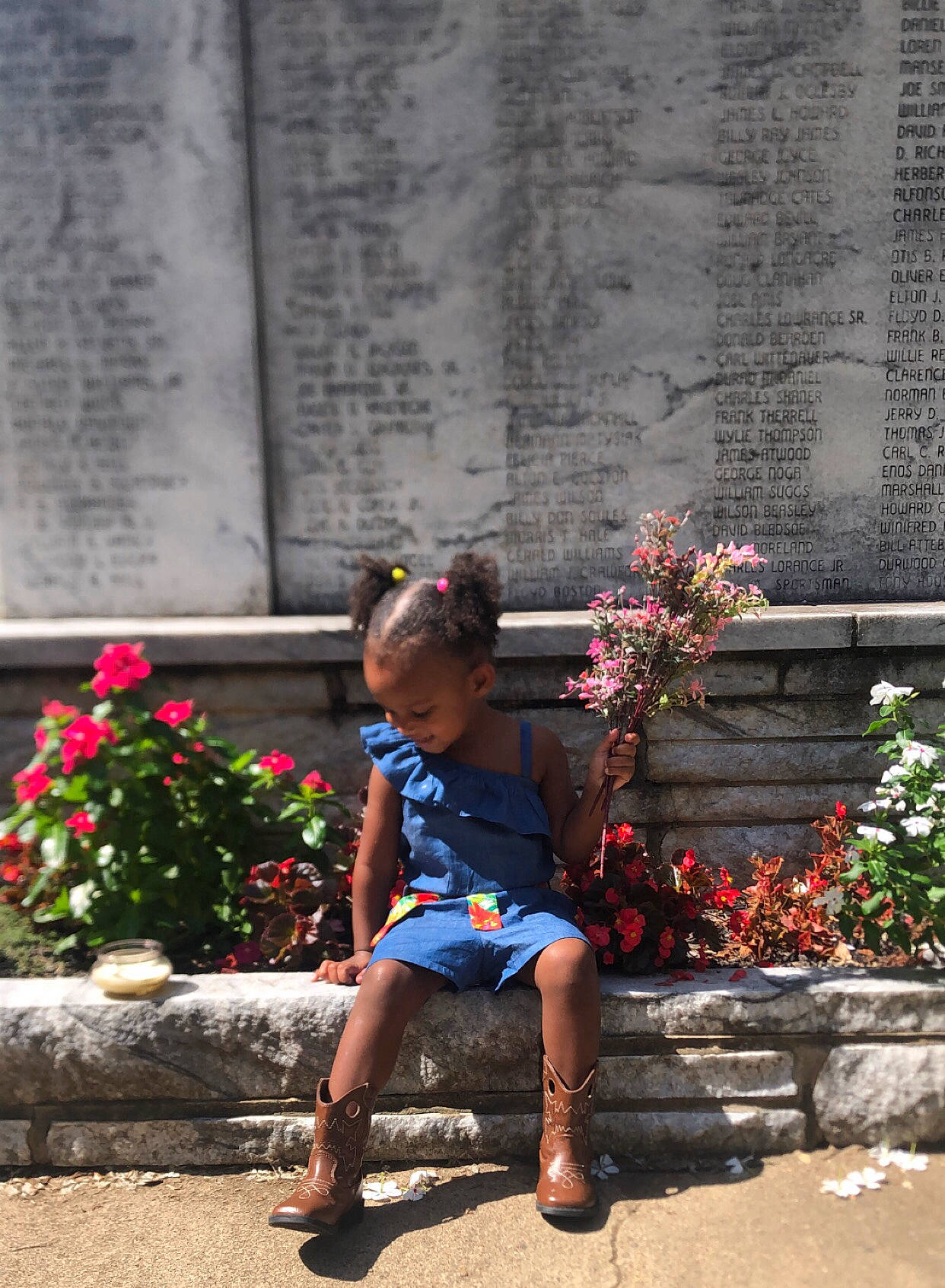 Carter joined the competition — help win amazing prizes! cobblestone, flooring, flower, foot, human_leg, leaf, leisure, person, plant, road, road_surface, shorts, sidewalk, sitting, street, sunglasses, t_shirt, temple, tints_and_shades, toddler