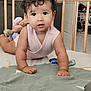 Divya participe au concours pour gagner de l'argent avec cette photo : baby, child, crib, crawling, curly_hair, indoor, looking_at_camera, play_mat, toy, wooden_crib, infant, cute, person, home_interior, floor, pink_clothing, expression, soft_lighting, close_up, curious