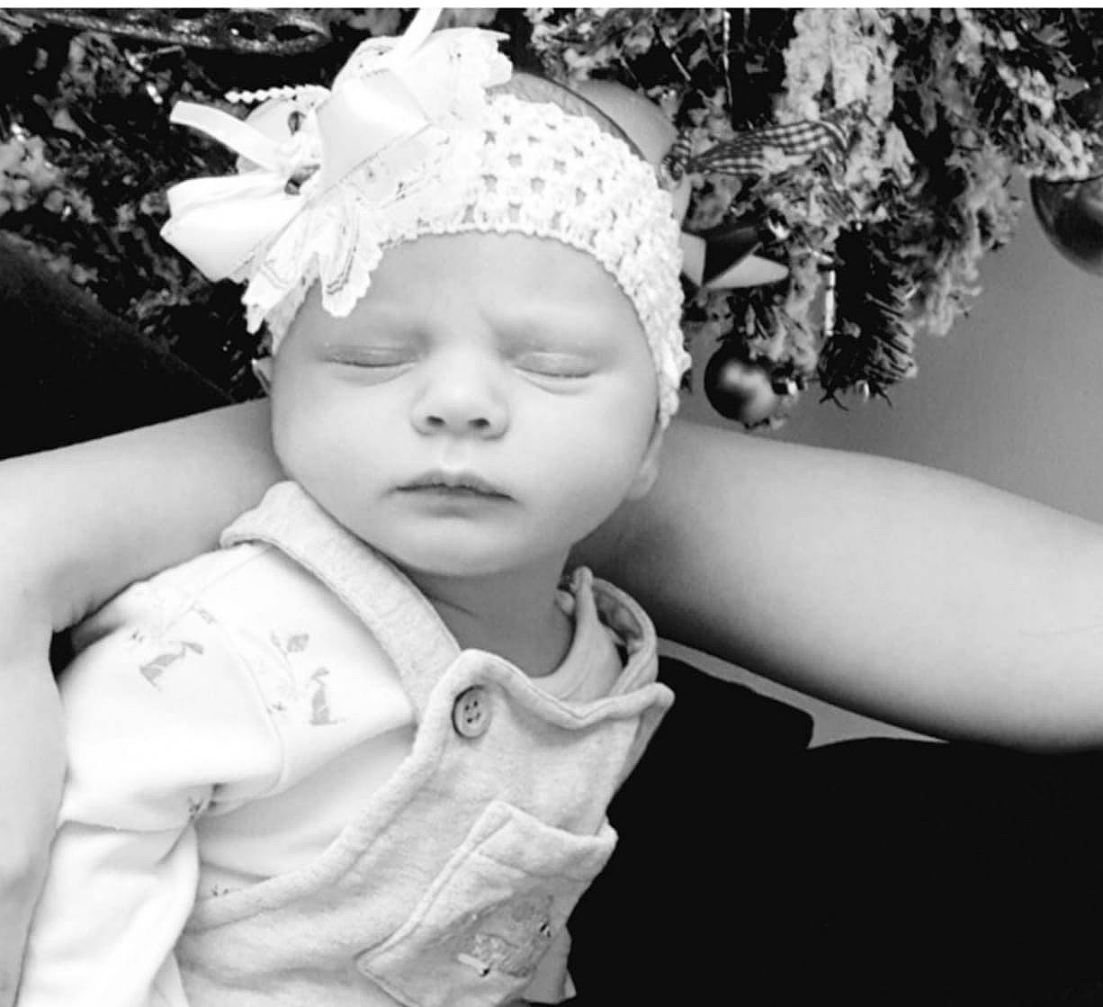 Maliah is registered to the contest to win money with this photo: baby, black_and_white, child, child_model, fashion_accessory, hair_accessory, headgear, headpiece, monochrome_photography, person, photo_shoot, photograph, photography, portrait, portrait_photography, smile, stock_photography, toddler