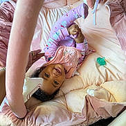 Sevyn joined the competition — help win amazing prizes! baby, child, infant, pink, pajamas, smile, happy, play_area, plush, cushion, pacifier, hand, foot, blanket, cozy, indoor, person, toddler, fabric, soft
