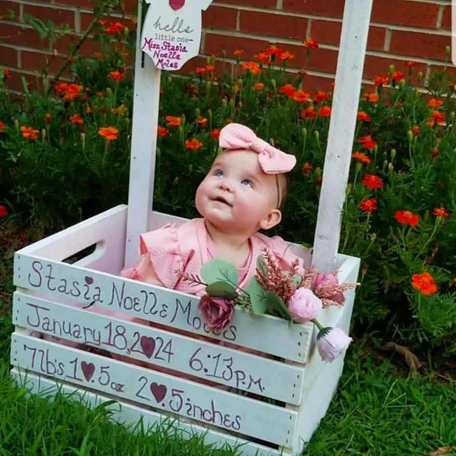 Stasia is registered to the contest to win money with this photo: backyard, brick, clothing, face, flower, grass, head, jar, nature, outdoors, person, petal, photography, plant, planter, portrait, pottedplant, pottery, vase, yard