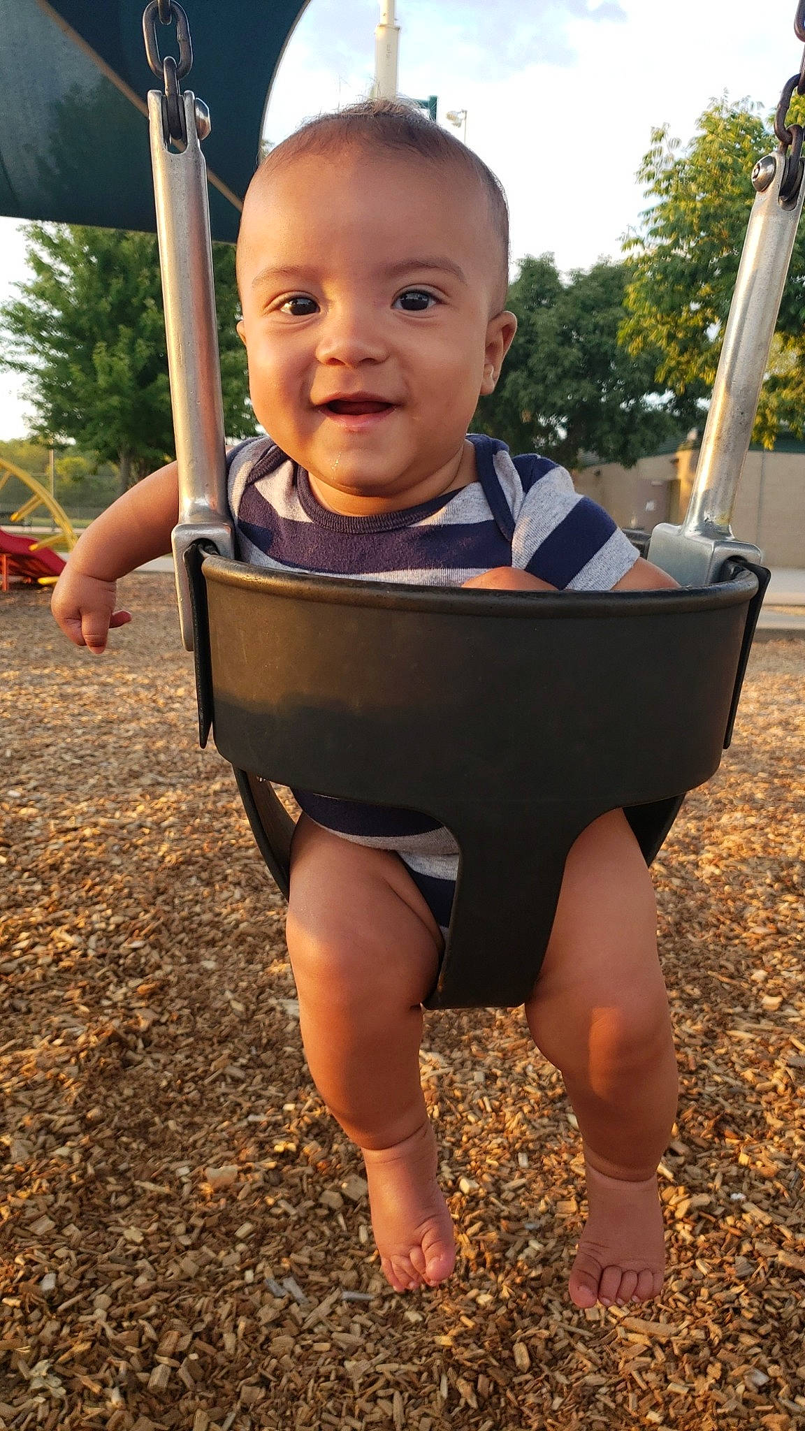 Legend joined the competition — help win amazing prizes! baby, barefoot, child, joy, leg, person, play, playground, smile, swing, toddler, vacation