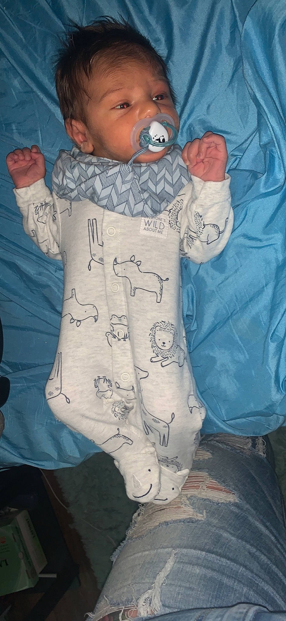 Kayne is registered to the contest to win money with this photo: baby, baby_products, baby_safety, baby_toddler_clothing, child, comfort, cool, face, gesture, hat, linens, outerwear, pattern, person, product, sleeve, space, t_shirt, textile, thumb