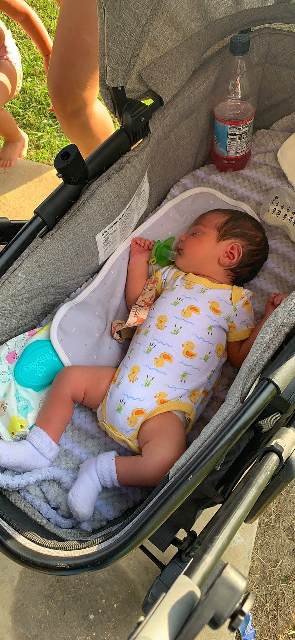 Kayne joined the competition — help win amazing prizes! baby, baby_carriage, baby_in_car_seat, baby_products, baby_safety, baby_sleeping, baby_toddler_clothing, car_seat, child, comfort, facial_expression, finger, green, hand, human_body, infant_bed, lap, mammal, person, skin