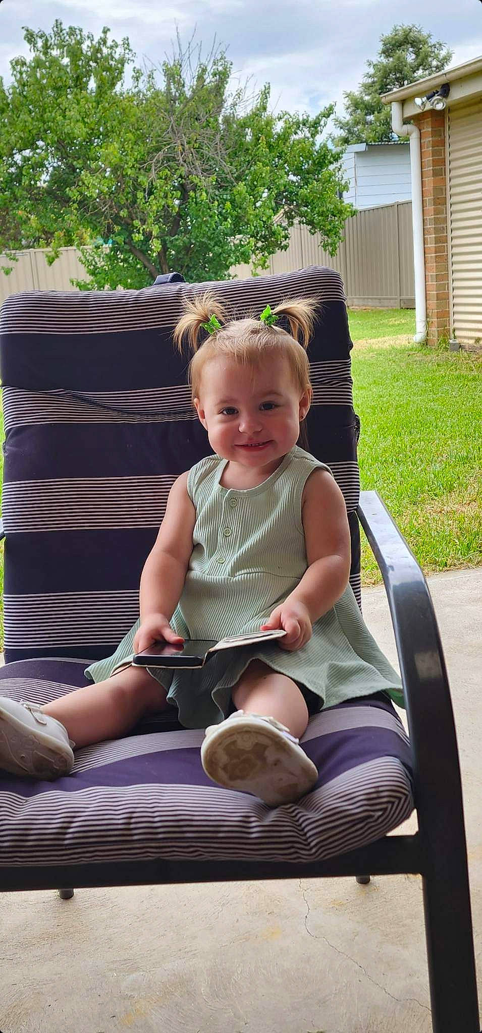 Avah joined the competition — help win amazing prizes! baby, baby_carriage, baby_toddler_clothing, child, comfort, fun, grass, happy, joy, lap, leisure, outdoor_furniture, person, plant, product, recreation, shorts, sitting, smile, toddler