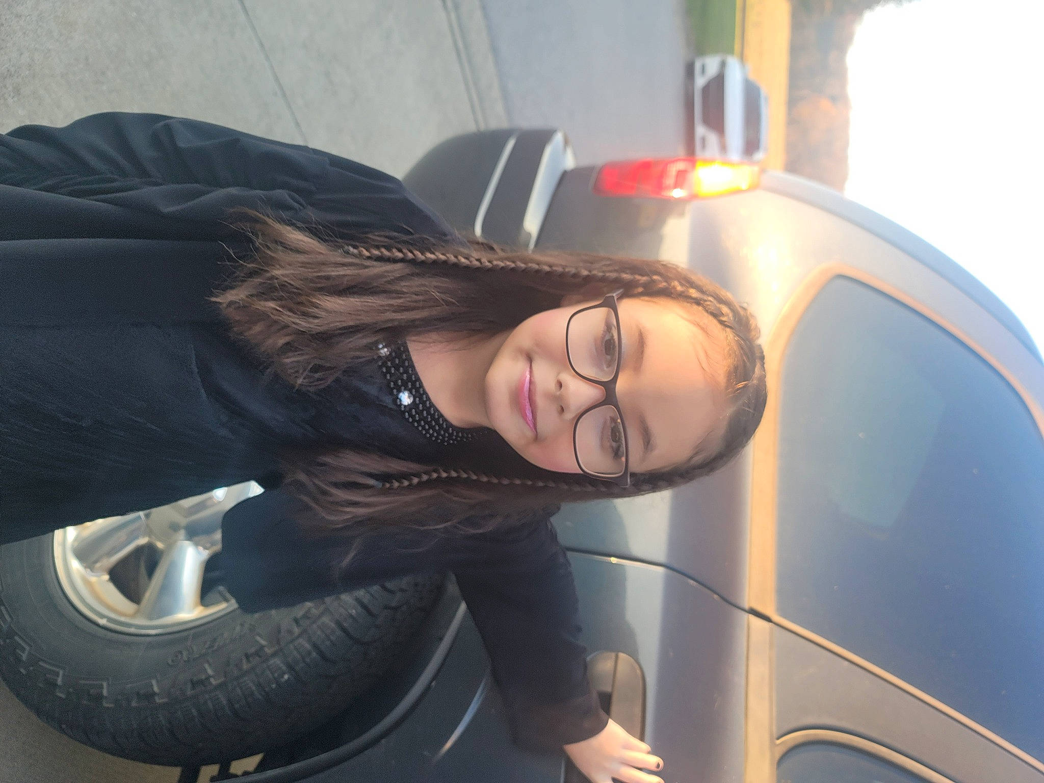 Annmarie is registered to the contest to win money with this photo: alloy_wheel, automotive_design, automotive_exterior, automotive_lighting, automotive_tire, bumper, car, headlamp, hood, hubcap, joy, motor_vehicle, person, personal_luxury_car, rim, smile, synthetic_rubber, tire, tread, vehicle