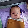 Kailecelove is registered to the contest to win money with this photo: baby, child, blanket, quilt, purple, mustard, wrapped, face, hair, tufts, lying_down, indoor, cute, expression, patterned_clothing, soft_fabric, infant, resting, cozy, portrait