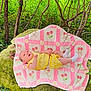 baby, infant, blanket, yellow_clothing, outdoor, nature, rock, greenery, trees, plants, forest, moss, cute, lying_down, socks, pattern, pink, white, cherry, curious