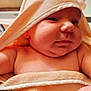 Persephone joined the competition — help win amazing prizes! baby, towel, hood, close_up, skin, infant, cute, child, soft_texture, warm, portrait, indoors, newborn, face, expression, chubby_cheeks, arm, wrapped, cozy, curious