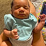 Ajayveon is registered to the contest to win money with this photo: baby, infant, sleeping, bib, person, skin, hand, legs, clothing, carpet, indoor, relaxation, peaceful, cute, newborn, closeup, comfort, human, lap, rest