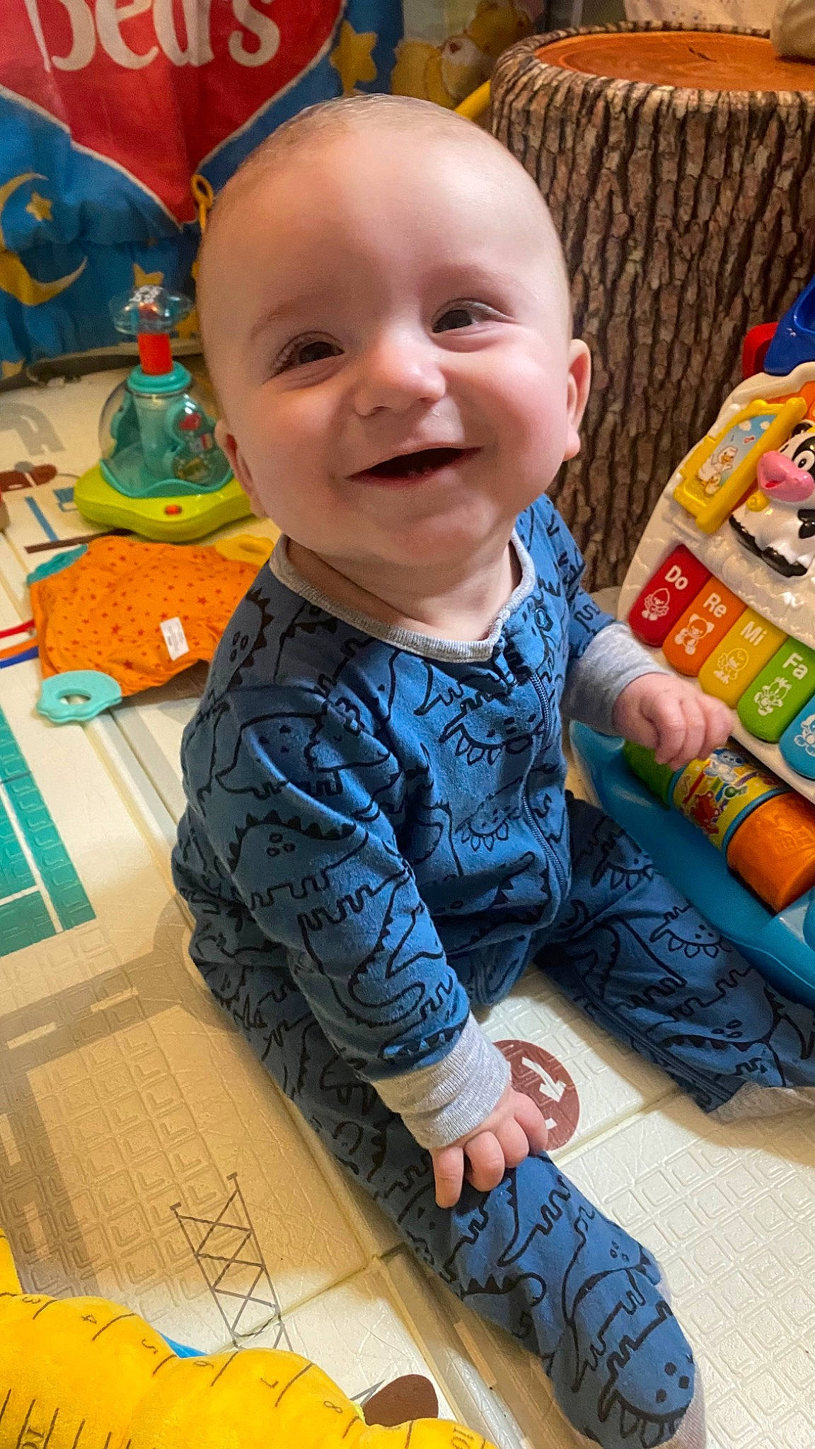 Weiland joined the competition — help win amazing prizes! baby, baby_products, baby_toddler_clothing, cheek, child, flooring, foot, fun, happy, head, joy, pattern, person, play, sitting, skin, sleeve, smile, t_shirt, toddler