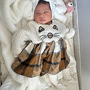 Violette Ramos joined the competition — help win amazing prizes! baby, baby_clothing, blanket, cat_costume, crib, crib_bedding, cute, fluffy_outfit, indoors, infant, mesh_rail, newborn, nursery, peaceful, pink_toy, plaid_skirt, plush_toy, portrait, sleeping, white_socks