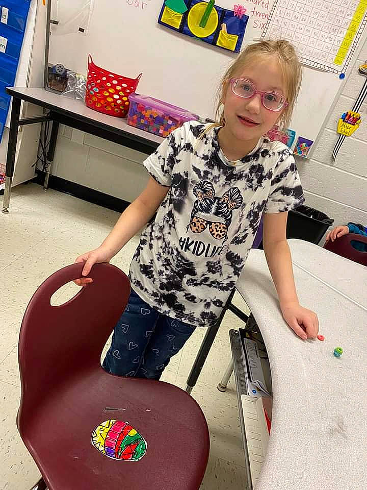 Madison joined the competition — help win amazing prizes! automotive_tire, chair, child, comfort, drum, fashion_design, fun, human_leg, job, joy, knee, leisure, person, recreation, room, shorts, sitting, smile, t_shirt, thigh