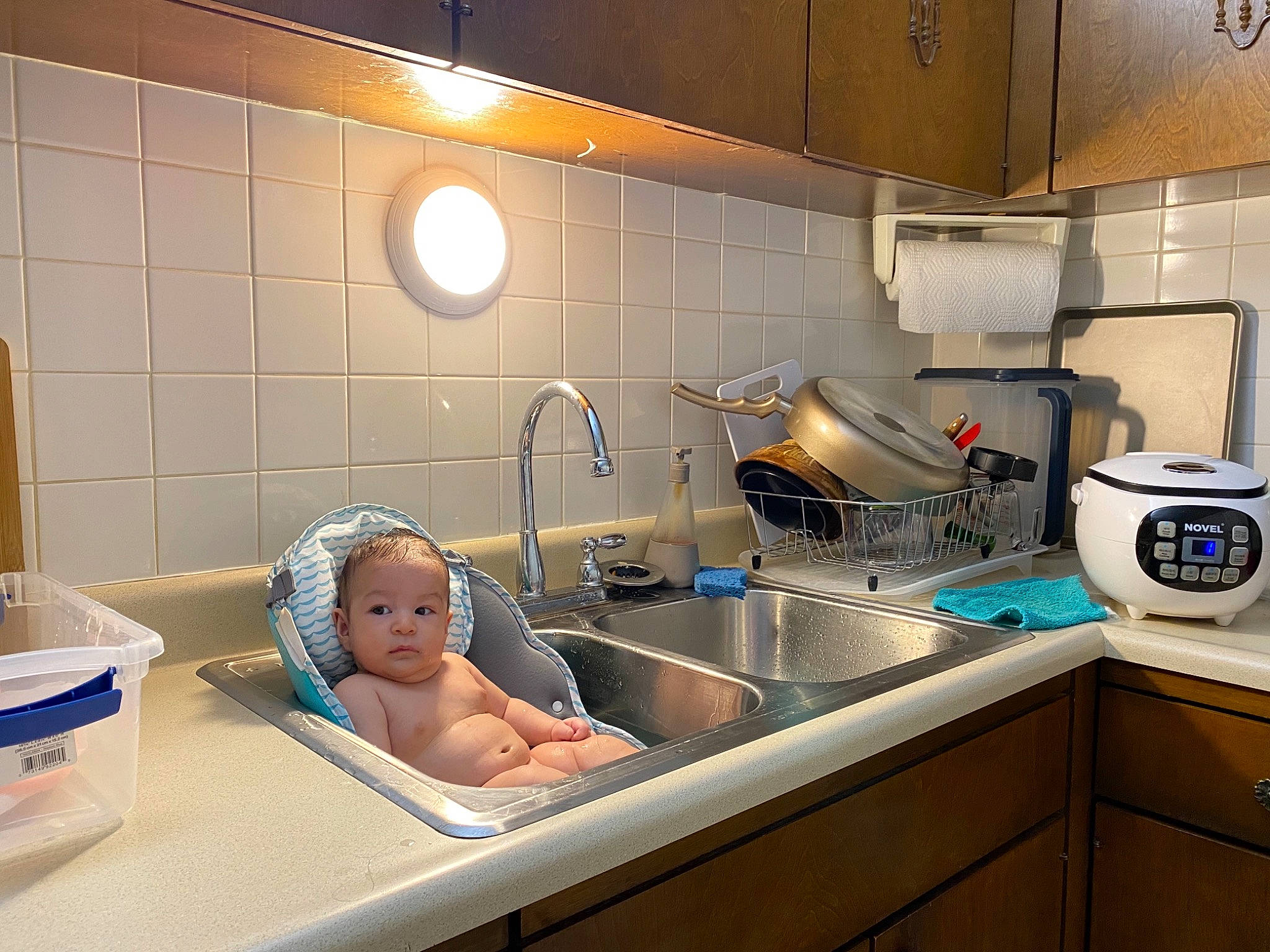 Emerson joined the competition — help win amazing prizes! baby, bathing, cabinetry, comfort, cooking, countertop, gas, gas_stove, home_appliance, kitchen, kitchen_appliance, kitchen_sink, kitchen_stove, major_appliance, person, plumbing_fixture, service, sink, stove, tap