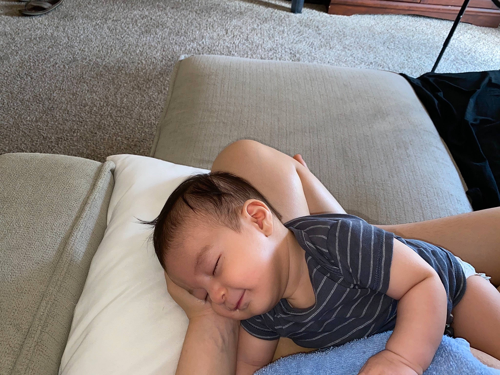 Emerson is registered to the contest to win money with this photo: chest, child, comfort, couch, elbow, eyelash, finger, flash_photography, flooring, human_body, human_leg, joint, knee, leg, linens, person, sitting, skin, textile, thigh