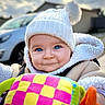 Emy a rejoint le concours — aidez-le/la à gagner de superbes lots ! baby, blue_eyes, car, child, closeup, colorful_toy, cute, face, fleece_jacket, happy, holding_toy, house, infant, knit_hat, outdoor, pom_pom, portrait, smiling, soft_light, winter_clothing