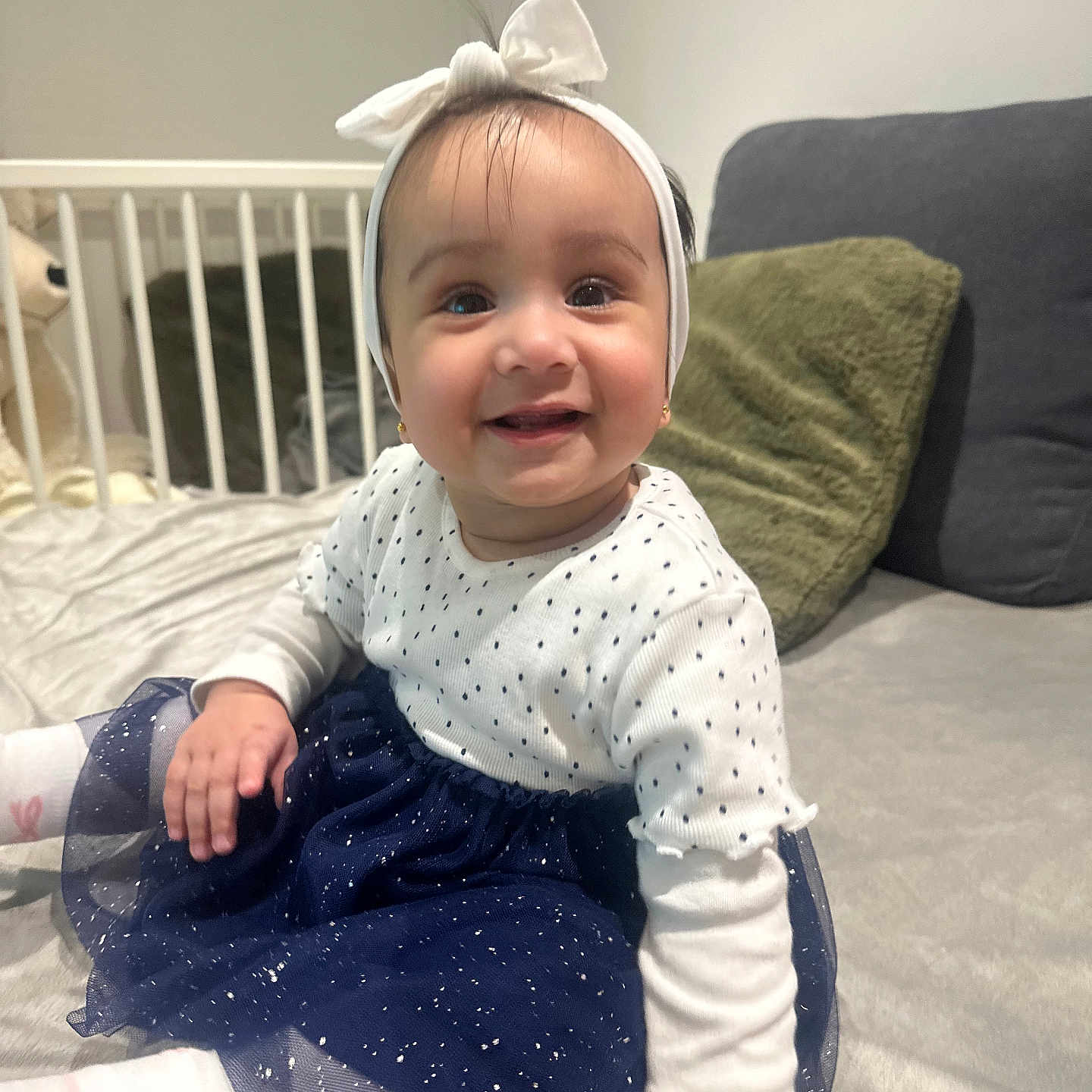 Zahra joined the competition — help win amazing prizes! architecture, baby, babylaughing, bed, bedroom, building, clothing, couch, crawling, crib, cushion, dress, face, furniture, happy, hat, head, homedecor, indoors, infantbed