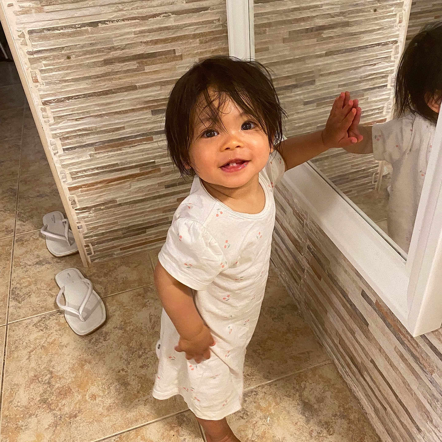 Leilani is registered to the contest to win money with this photo: bathroom, blackhair, child, clothing, face, female, footwear, girl, hair, hardwood, head, indoors, interiordesign, person, photography, portrait, shoe, sitting, sleeve, wood