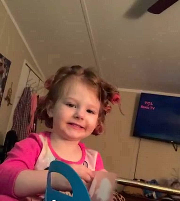 Kimberly is registered to the contest to win money with this photo: cheek, ear, electronic_device, eyebrow, eyelash, finger, fun, gadget, hair, happy, iris, joy, mouth, nose, output_device, person, smile, standing, t_shirt, technology