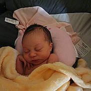 Nova is registered to the contest to win money with this photo: baby, newborn, sleeping, blanket, pillow, bed, rest, infant, soft, cozy, peaceful, nursery, child, wrapped, cute, person, skin, indoors, calm, relax