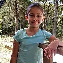 Elliana joined the competition — help win amazing prizes! chest, elbow, fun, gesture, grass, happy, joy, leisure, person, physical_fitness, plant, recreation, sitting, sleeve, smile, soil, sportswear, t_shirt, thumb, tree