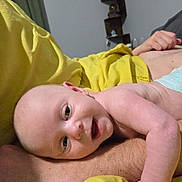 Oliver joined the competition — help win amazing prizes! baby, infant, smiling, face, arm, yellow_blanket, person, skin, indoor, shelf, decor, room, happy, lying_down, closeup, skin_tone, blanket, baby_face, human, relaxing