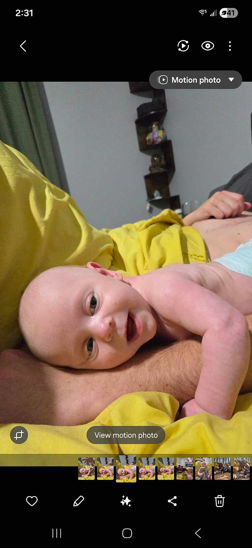 Oliver joined the competition — help win amazing prizes! baby, infant, smiling, face, arm, yellow_blanket, person, skin, indoor, shelf, decor, room, happy, lying_down, closeup, skin_tone, blanket, baby_face, human, relaxing