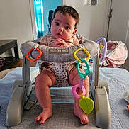 Selina joined the competition — help win amazing prizes! baby, baby_walker, child, clothing, colorful, curious, door, feet, floor, furniture, hands, indoor, infant, plastic, portrait, room, sitting, toys, window, young