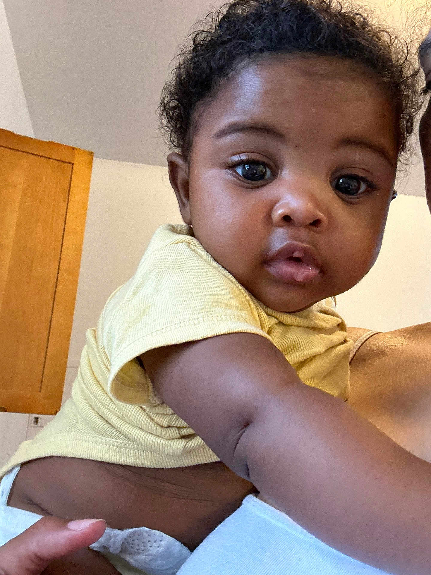 Ja Kai joined the competition — help win amazing prizes! baby, child, indoor, yellow_shirt, curious, close_up, arm, diaper, person, skin, expression, face, human, young, portrait, cute, infant, hand, eye, hair