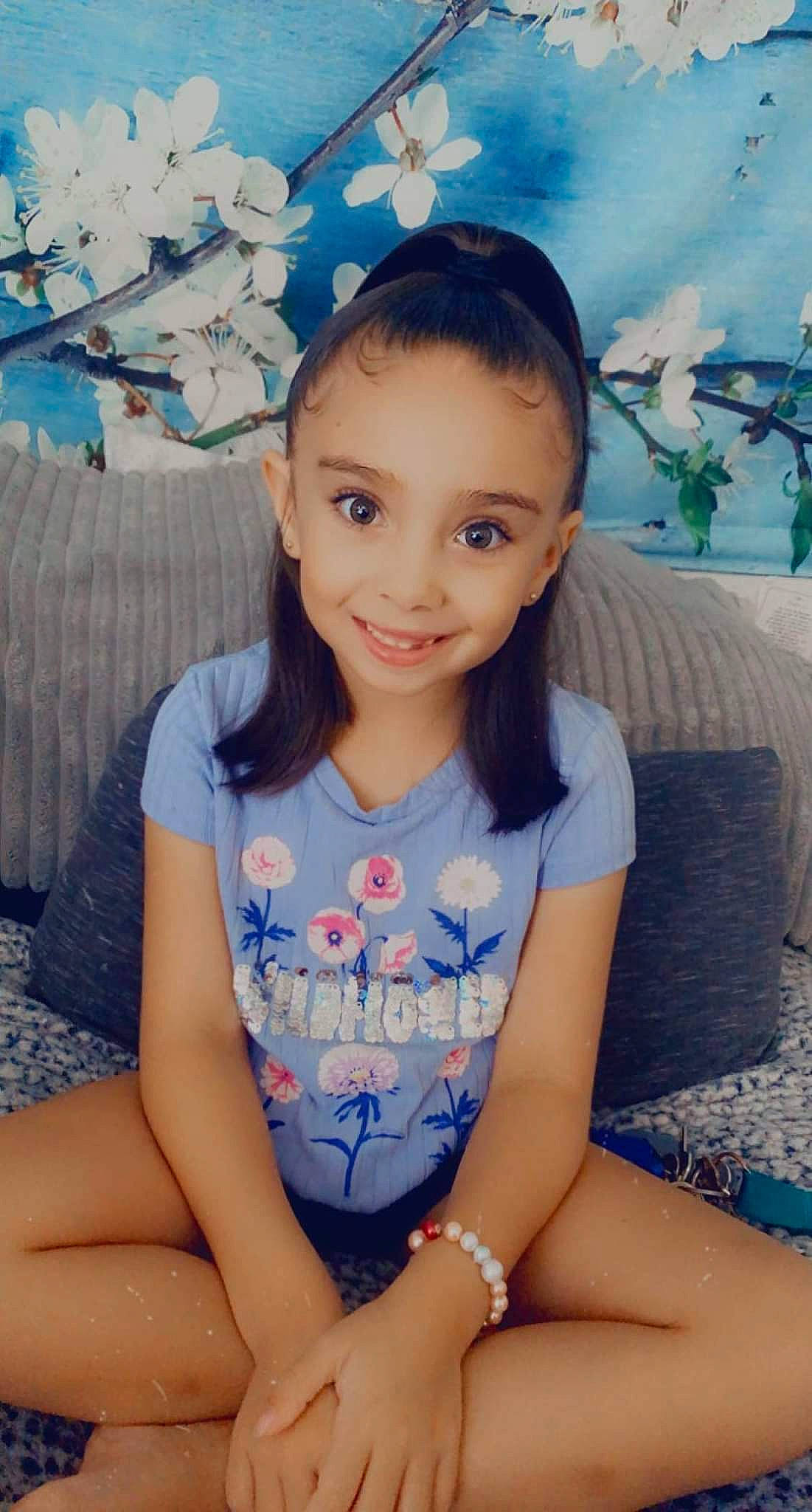 Aubrey Jean Friend is registered to the contest to win money with this photo: blue, eye, face, facial_expression, hair, hairstyle, happy, head, human_body, iris, joy, knee, leisure, neck, person, pink, shorts, skin, sleeve, smile