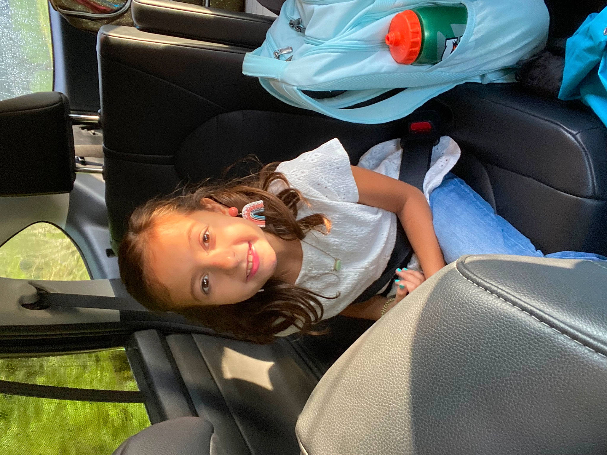 Madelynn is registered to the contest to win money with this photo: auto_part, automotive_design, automotive_exterior, baby_products, car_seat, car_seat_cover, carmine, child, comfort, family_car, fun, grass, joy, lap, leisure, luxury_vehicle, motor_vehicle, person, sitting, toddler