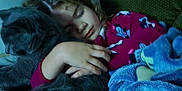 Ellie joined the competition — help win amazing prizes! child, sleeping, cat, hugging, blanket, couch, indoor, cozy, relaxing, young, peaceful, home, furniture, comfort, pet, animal, person, resting, curly_hair, warm_lighting