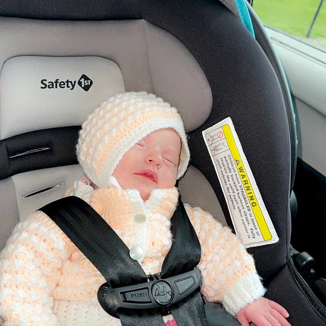 Marceline is registered to the contest to win money with this photo: accessories, baby, belt, bonnet, cap, car, car_interior, carseat, clothing, cushion, face, glove, hat, head, homedecor, person, photography, portrait, transportation, vehicle