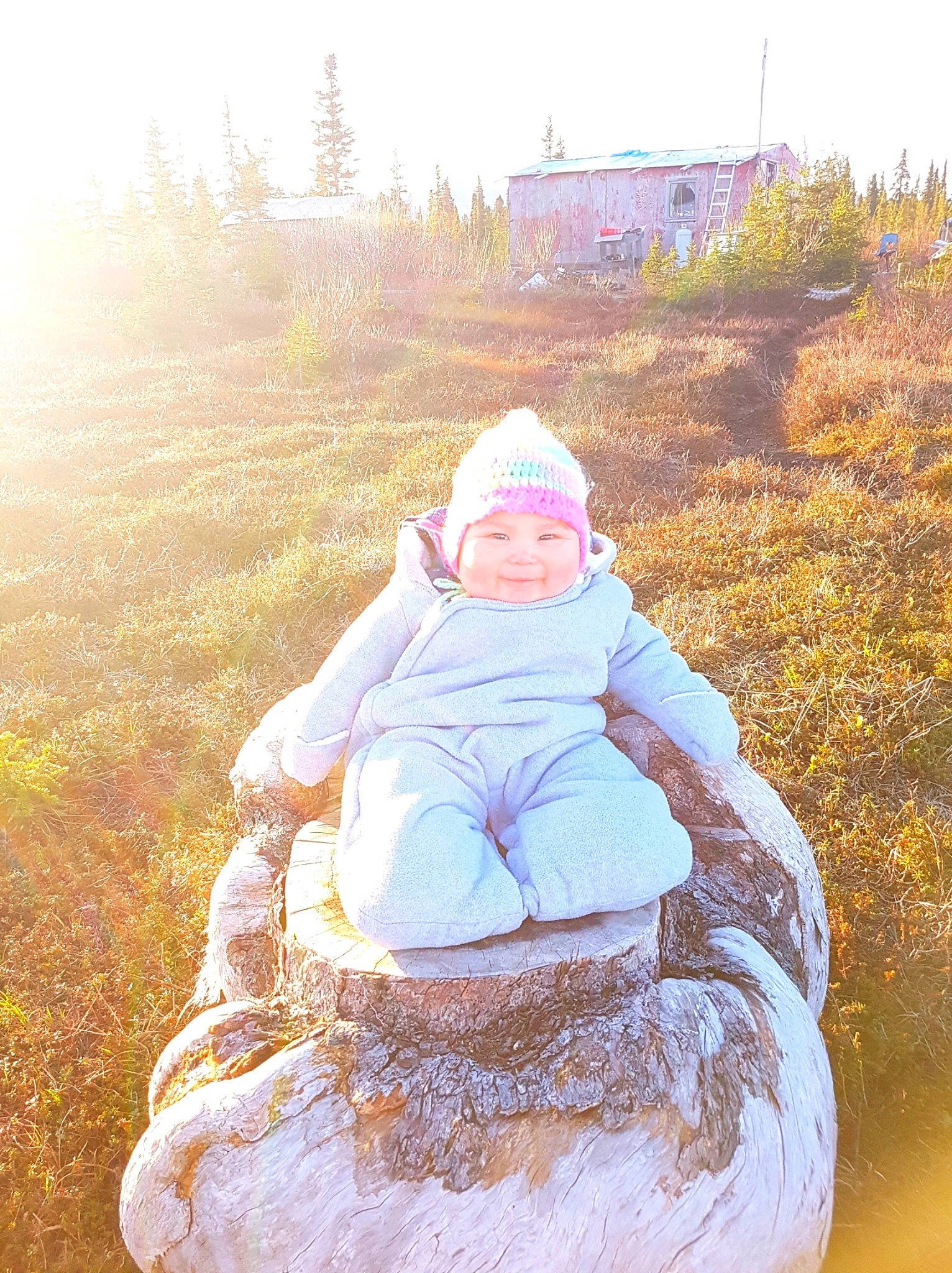 Emmalyn is registered to the contest to win money with this photo: fun, grass, happy, headwear, leisure, person, photography, sitting, sunlight, tree