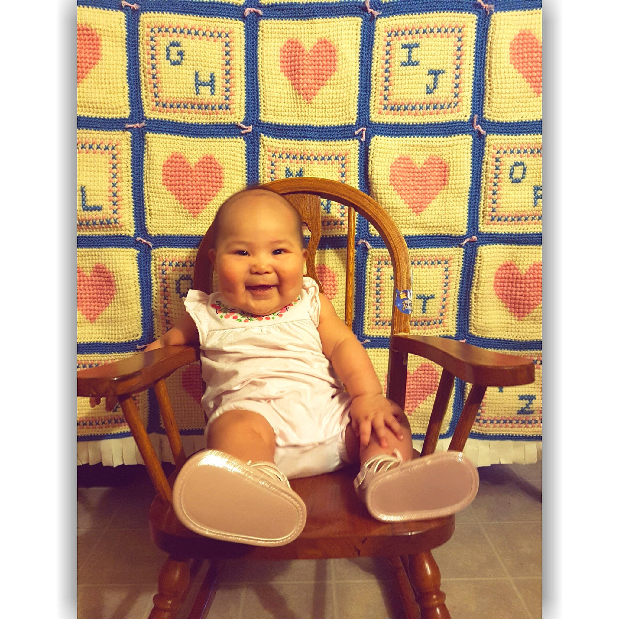 Emmalyn is registered to the contest to win money with this photo: baby, beige, child, furniture, joy, pattern, person, room, sitting, textile, toddler