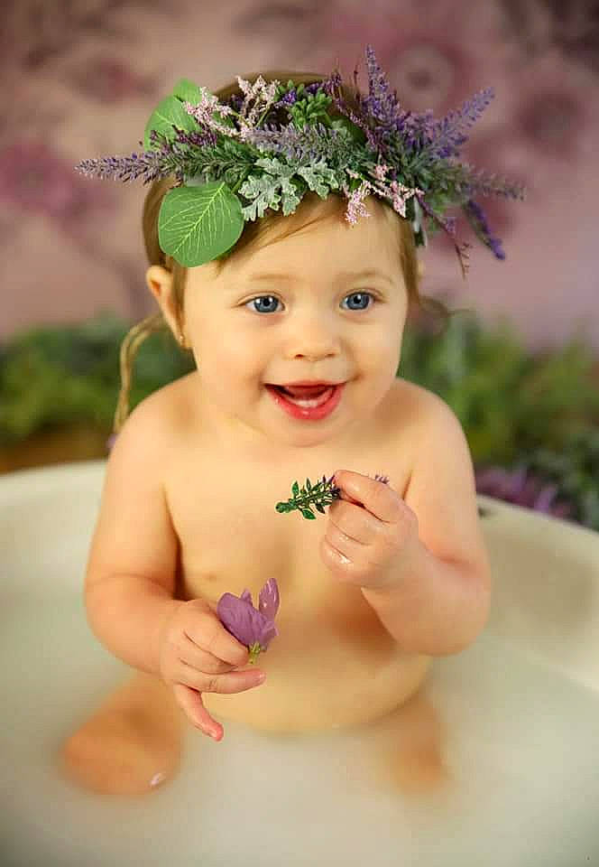 Lillianna joined the competition — help win amazing prizes! baby, child, child_model, crown, fashion_accessory, flower, hair_accessory, hand, happy, headband, headgear, headpiece, headwear, joy, person, photograph, photography, plant, portrait, skin