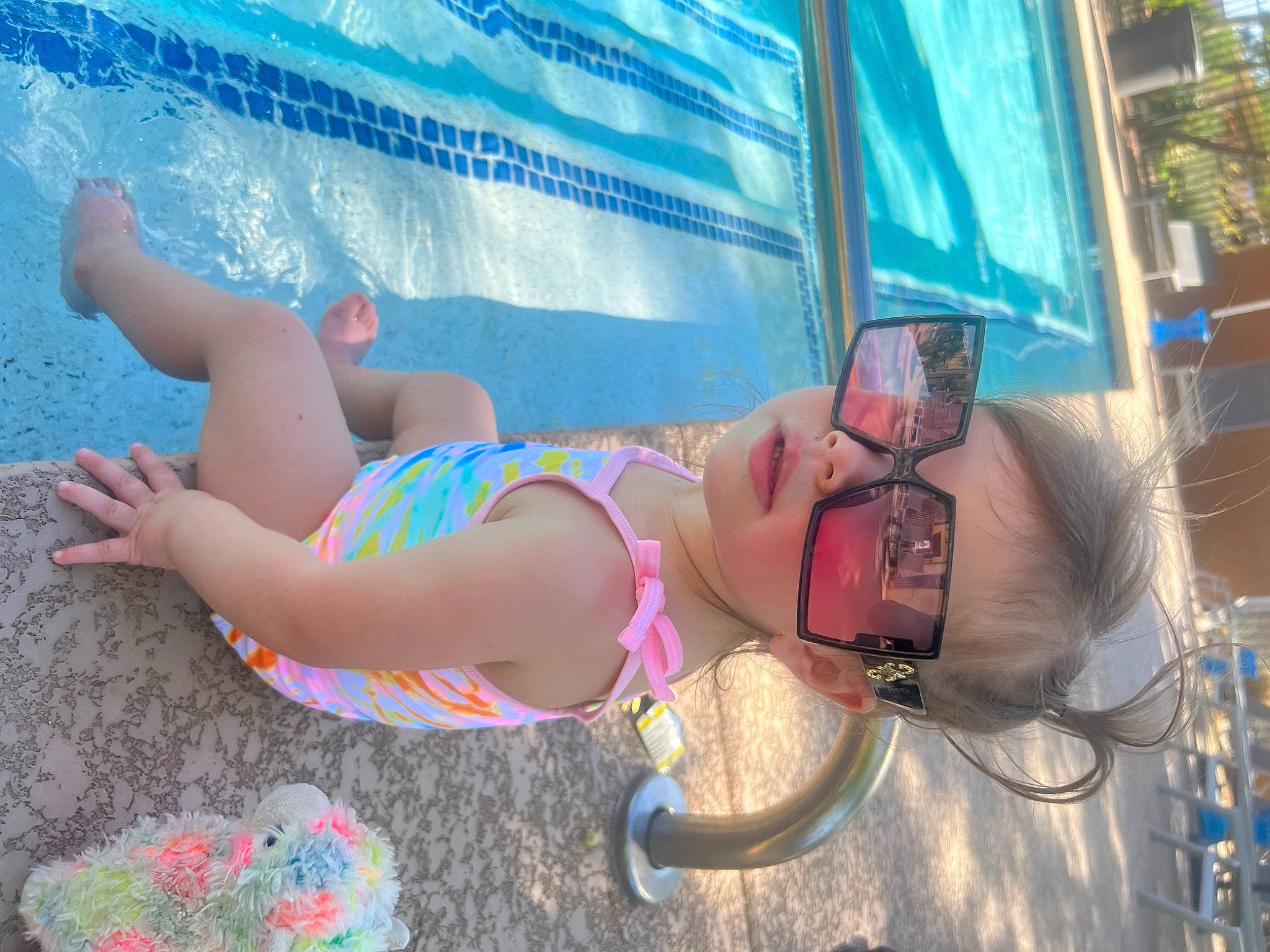 Sophia is registered to the contest to win money with this photo: brassiere, chest, eyewear, fun, glasses, goggles, hat, headgear, human_leg, leisure, person, recreation, sunglasses, swimming_pool, swimsuit_top, swimwear, thigh, tree, trunk, underpants