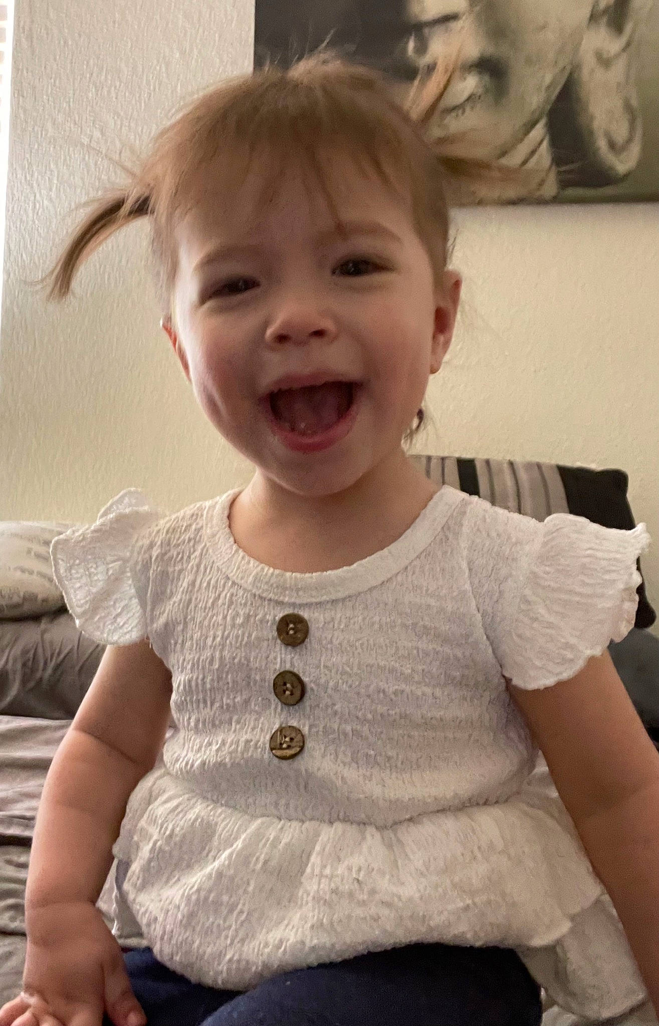 Sophia is registered to the contest to win money with this photo: arm, baby_toddler_clothing, cheek, chin, eye, gesture, hair, hairstyle, happy, human_body, iris, joint, lip, mouth, neck, nose, person, shoulder, skin, sleeve