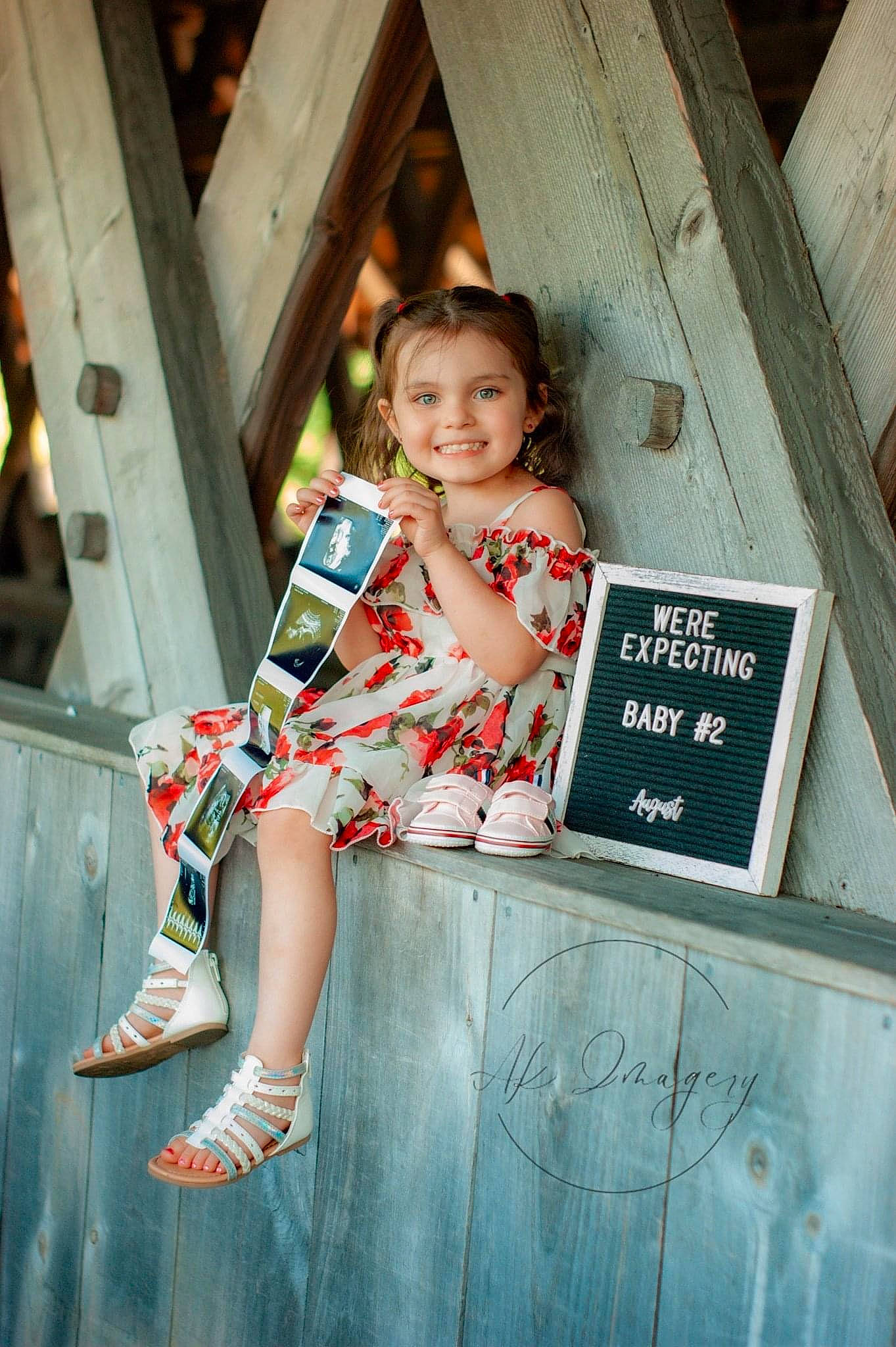 Layla Ogle joined the competition — help win amazing prizes! box, child, dress, flash_photography, foot, fun, happy, human_leg, joy, leisure, magenta, pattern, person, portrait_photography, sandal, sitting, smile, standing, t_shirt, thigh