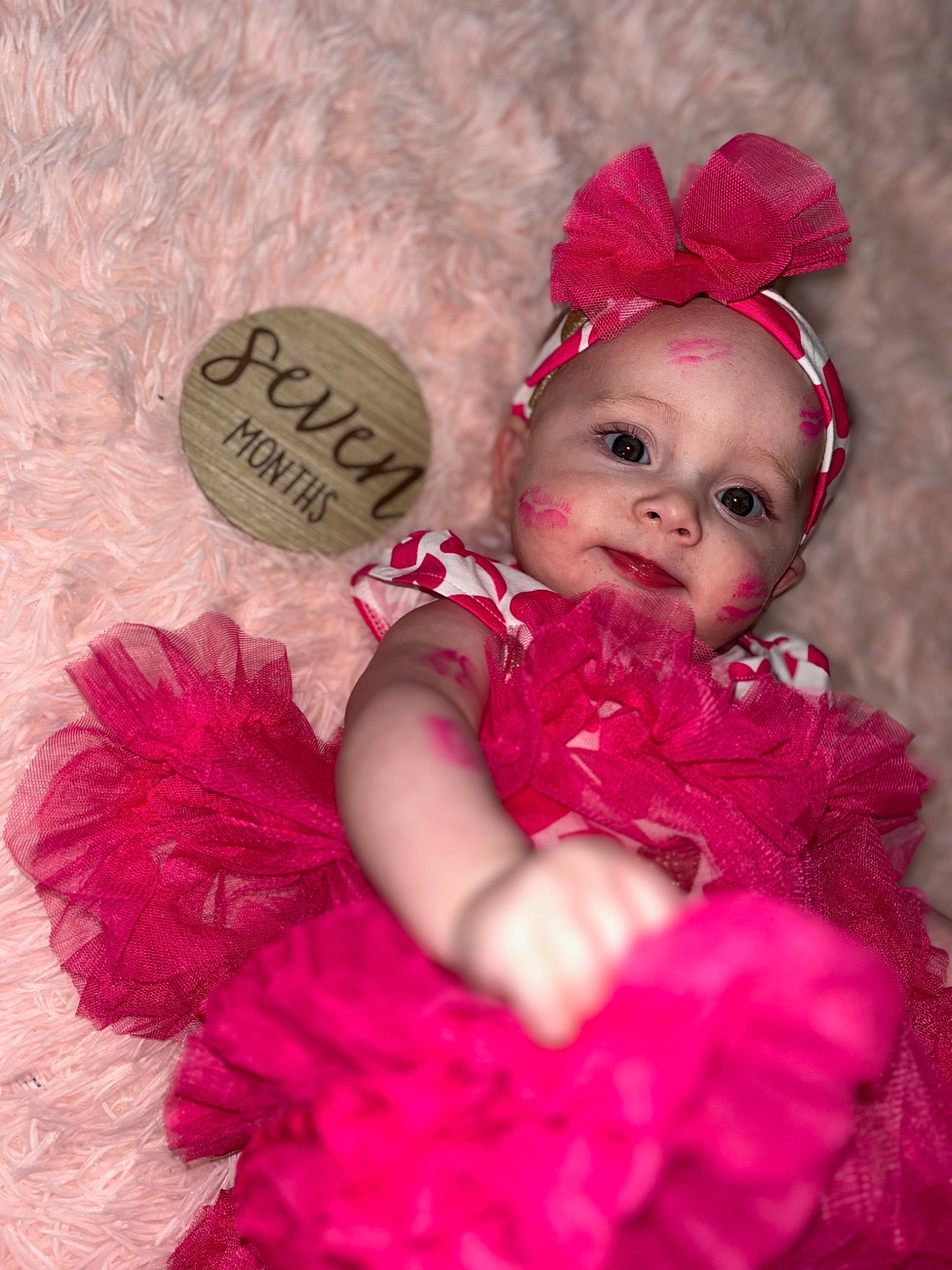 Lyla is registered to the contest to win money with this photo: baby_toddler_clothing, child, costume_hat, dress, embellishment, event, eye, hair_accessory, happy, head, headpiece, headwear, magenta, ornament, person, petal, pink, purple, skin, smile