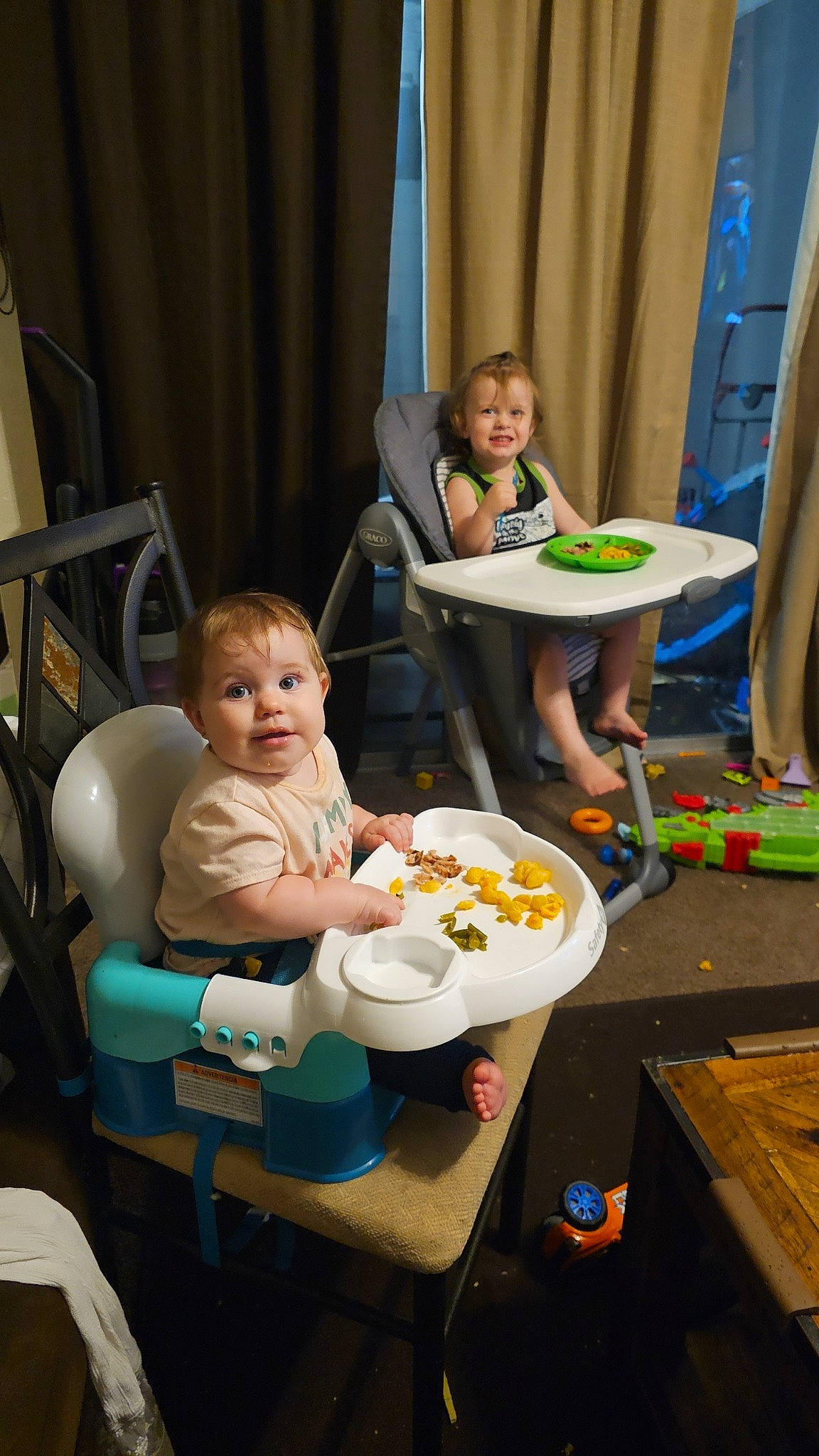 Kinsley is registered to the contest to win money with this photo: baby, baby_products, chair, child, comfort_food, cooking, curtain, event, food, fun, joy, leisure, party, person, room, sharing, sitting, table, tableware, toddler