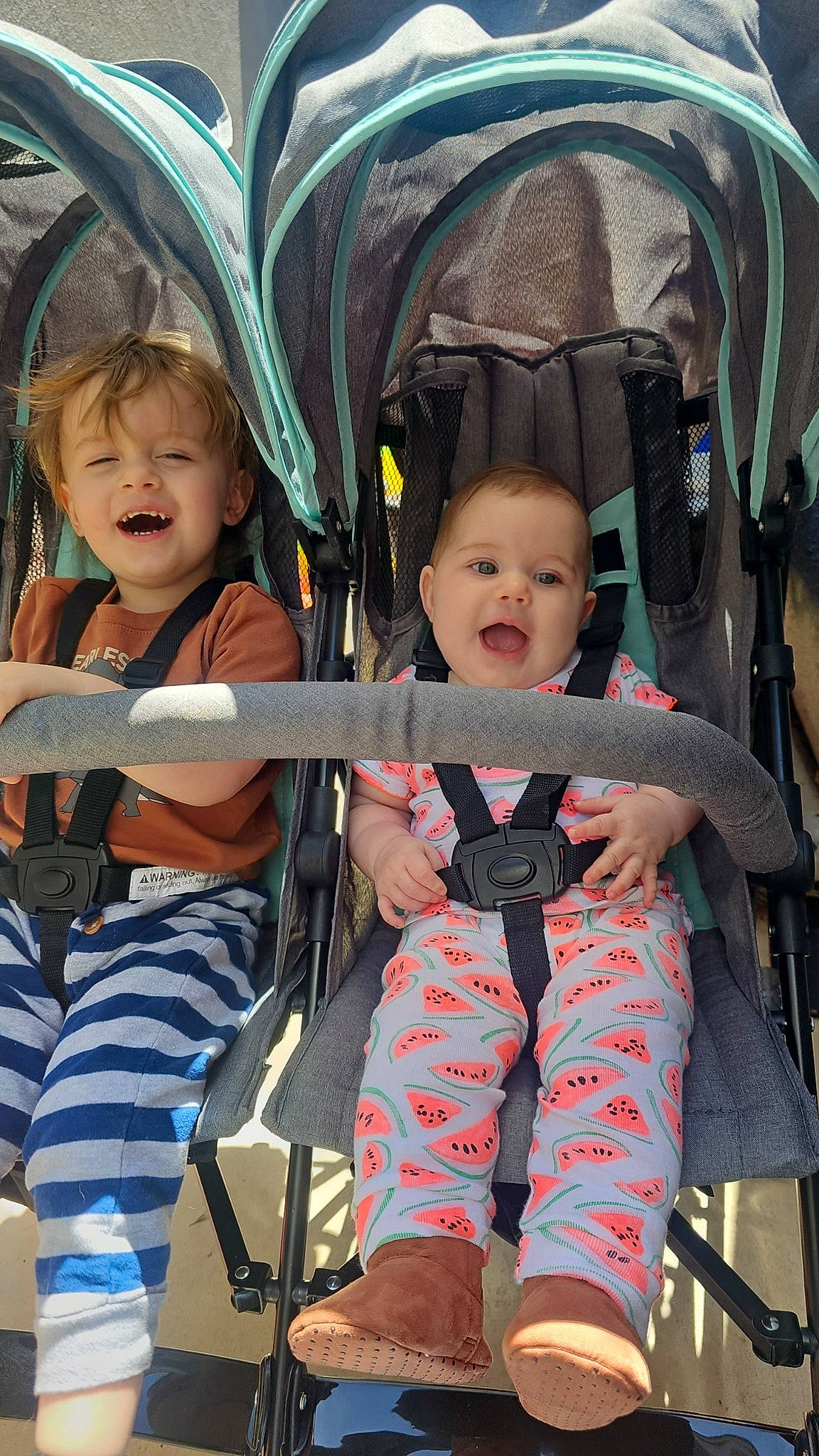 Kooper is registered to the contest to win money with this photo: baby_carriage, baby_products, beauty, child, comfort, event, eye, facial_expression, fun, happy, human, lap, leisure, person, recreation, sitting, skin, smile, toddler, travel
