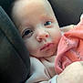 baby, infant, face, eyes, blanket, clothing, pink, cushion, car_seat, portrait, closeup, young_child, cute, soft_light, skin, expression, comfort, resting, small_hand, newborn