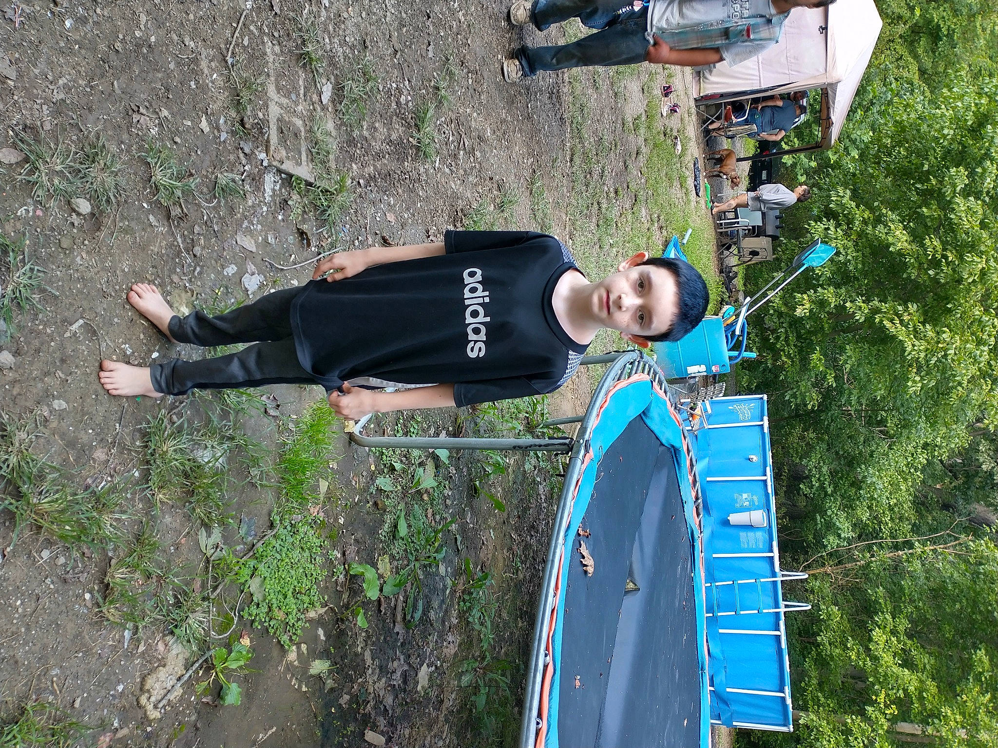 Johnathan is registered to the contest to win money with this photo: boat, boats_and_boating_equipment_and_supplies, electric_blue, fun, grass, hat, leisure, outdoor_shoe, person, plant, pole, recreation, shorts, skiff, t_shirt, tree, vehicle, walking_shoe, water_transportation, watercraft