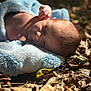 baby, blanket, sleeping, outdoor, autumn, leaves, sunlight, infant, peaceful, nature, skin, soft_texture, closeup, child, head, face, relaxation, cocoon, toddler, warm_light